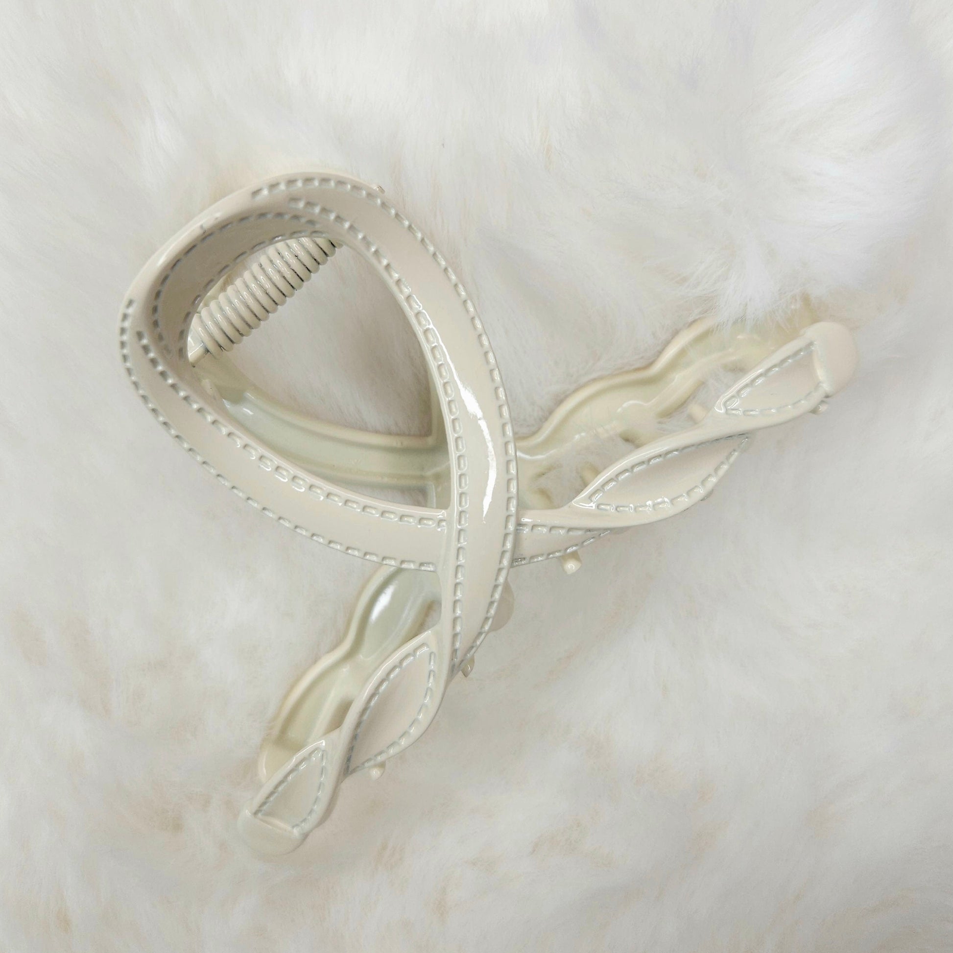 White hair clip on a white background