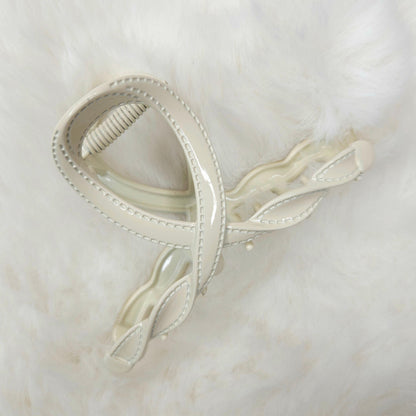 White hair clip on a white background